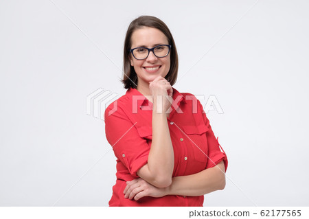 Beautiful mature happy woman smiling confidently looking aside on copyspace. Beautiful mature happy woman smiling confidently looking aside on copyspace. 62177565