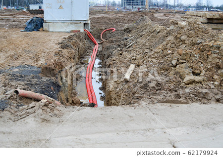 Large red plastic corrugated pipes with wires  62179924