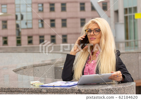 Young Blond Business Woman In red Suit Young Blond Business Woman In red Suit 62184620