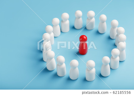 A team of white people stands around and listens 62185556