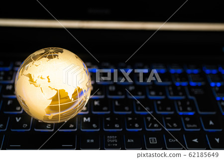Global network-glowing globe and personal computer 62185649