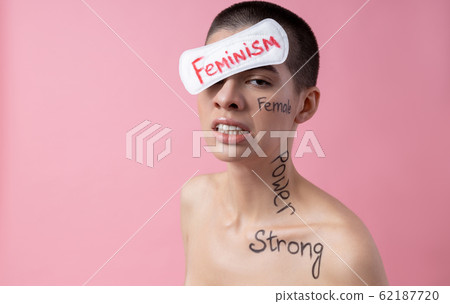 Feministic aggressive woman with words written on her stock photo 62187720