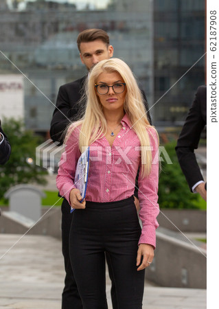 Young Blond Business Woman In red Suit Young Blond Business Woman In red Suit 62187908