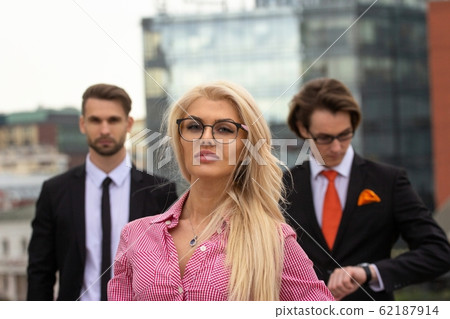 Young Blond Business Woman In red Suit 62187914