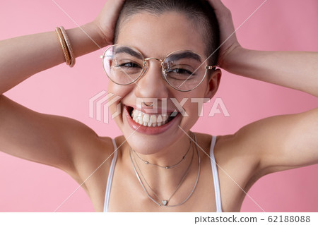 Excited lovely lady smiling and touching head stock photo 62188088