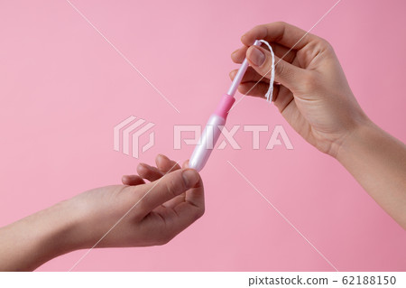 Sharing tampons while having periods stock photo Sharing tampons while having periods stock photo 62188150