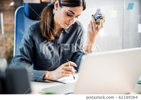 Concentrated office worker reading her plans for the day 62189364