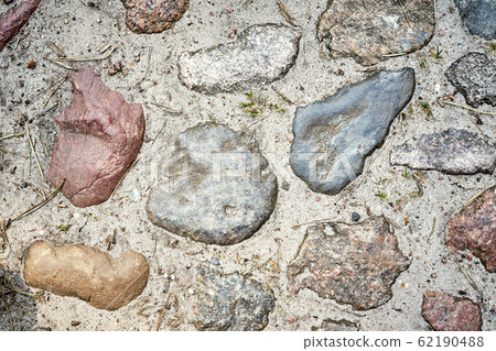 Stone pavement road with colored stones 62190488