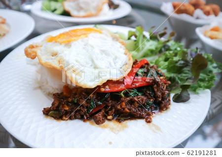 stir fried pork with holy basil or Rice topped stir fried pork with holy basil or Rice topped 62191281