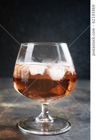cognac with ice cubes cognac with ice cubes 62193869