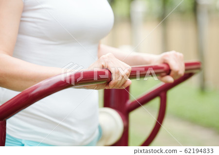 Woman exercising outdoors Woman exercising outdoors 62194833