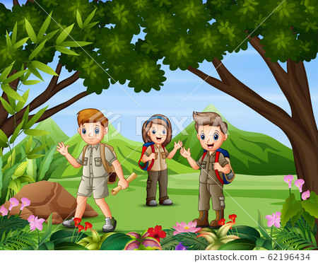 A group of scouts hiking in the forest 62196434