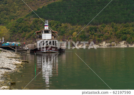 Russia. Krasnodar region. Pleasure boat Champagne on the picturesque lake Abrau in the vicinity of Novorossiysk. Russia. Krasnodar region. Pleasure boat Champagne on the picturesque lake Abrau in the vicinity of Novorossiysk. 62197590
