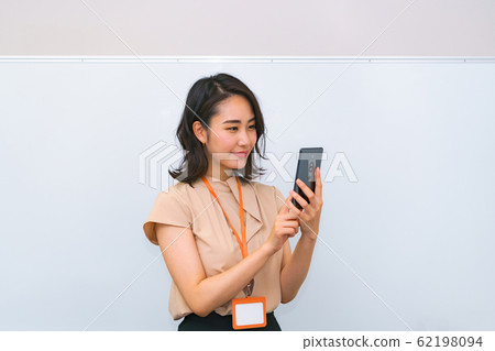 5G Smartphone Demonstration Female Exhibitor Exhibition Business Image Female Smartphone Lifestyle Business 5G Smartphone Demonstration Female Exhibitor Exhibition Business Image Female Smartphone Lifestyle Business 62198094