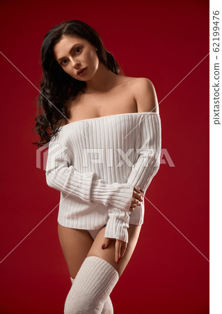 Brunette model posing, isolated on red. Brunette model posing, isolated on red. 62199476