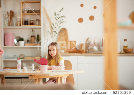 Cute Girl Posing with Valentines Card 62201899