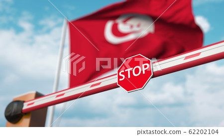Closed boom barrier with stop sign against the Tunisian flag. Restricted border crossing or certain ban in Tunisia. 3D rendering Closed boom barrier with stop sign against the Tunisian flag. Restricted border crossing or certain ban in Tunisia. 3D rendering 62202104