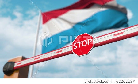 Barrier gate being closed with flag of Luxembourg as a background. Luxembourgian restricted border crossing or certain ban. 3D rendering Barrier gate being closed with flag of Luxembourg as a background. Luxembourgian restricted border crossing or certain ban. 3D rendering 62202157