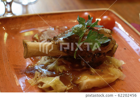 lamb shank delicious food on the plate 62202456