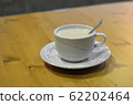 detail of coffee drink with spoon on the table 62202464