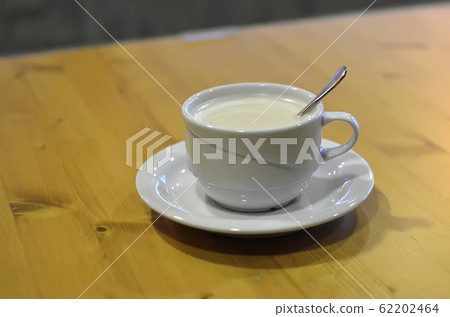 detail of coffee drink with spoon on the table 62202464