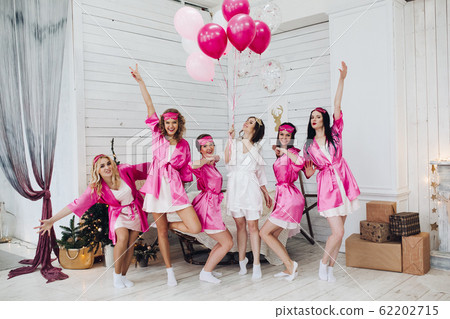 Bridesmaids and bride having fun at bachelorette 62202715