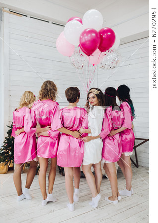 Full length of bride in white robe with 62202951