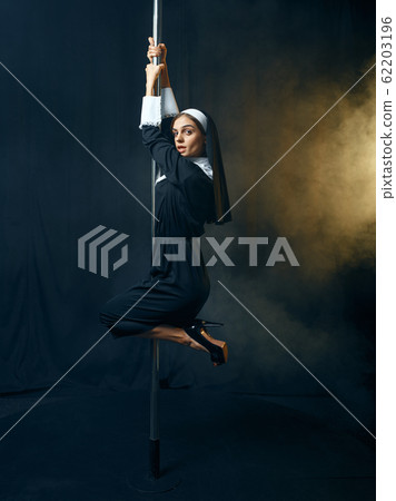 Sexy nun in cassock dances on pole like a stripper 62203196