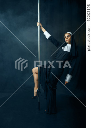 Sexy nun in cassock dances on pole like a stripper Sexy nun in cassock dances on pole like a stripper 62203198
