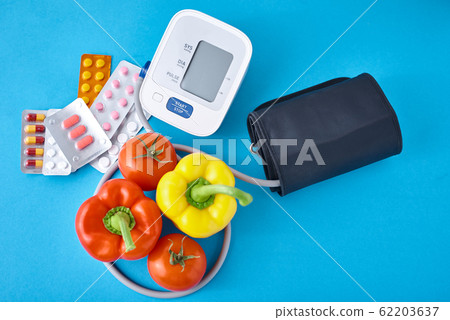 Digital blood pressure monitor, fresh vegetables Digital blood pressure monitor, fresh vegetables 62203637
