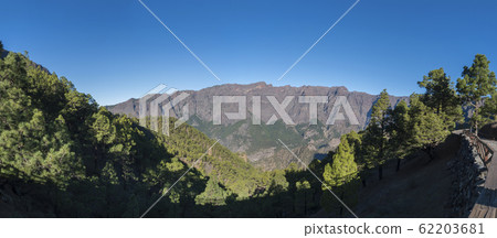 Panoramic view on volcanic landscape and lush pine tree forest, pinus canariensis from Mirador de la Cumbrecita viewpoint at national park Caldera de Taburiente, volcanic crater in La Palma, Canary 62203681