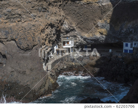 Cueva de Candelaria, Pirate cave Poris de Candelaria, small hidden fisherman village with white and blue houses, tourist attraction near Tijarafe, La Palma, Canary islands, Spain Cueva de Candelaria, Pirate cave Poris de Candelaria, small hidden fisherman village with white and blue houses, tourist attraction near Tijarafe, La Palma, Canary islands, Spain 62203706