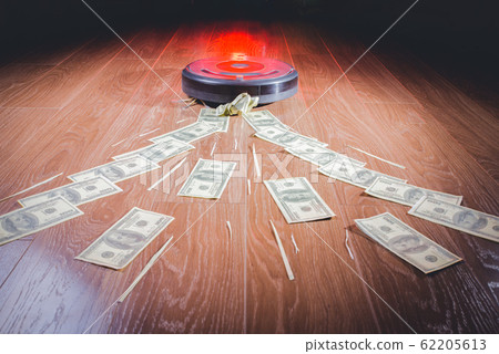 Businessman attracting money with a horseshoe 62205613