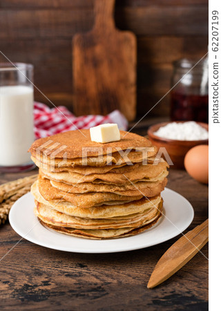 Stack of thin crepes, blini with butter Stack of thin crepes, blini with butter 62207199