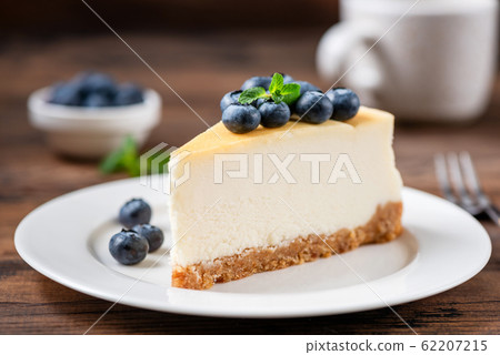 Cheesecake slice with blueberries 62207215