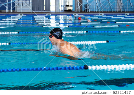 Swimmer swimming in the pool 62211437