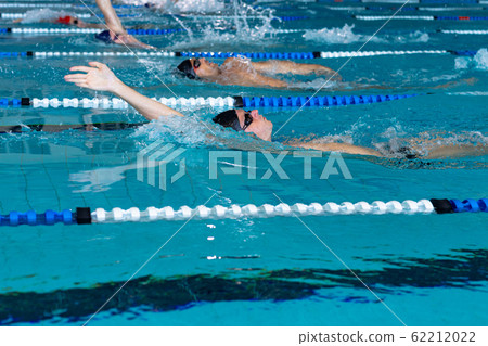 Swimmers swimming in the pool 62212022