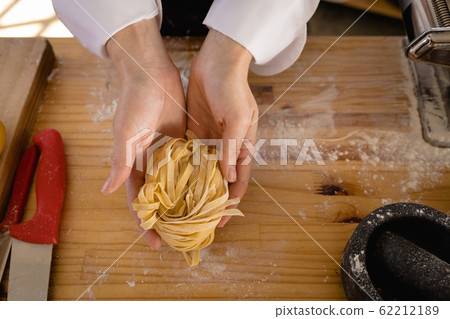 Caucasian chef making pasta 62212189