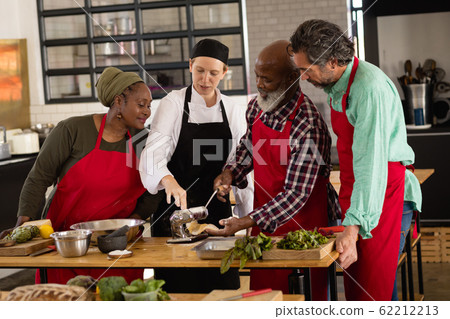 Chefs cooking together Chefs cooking together 62212213