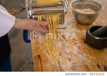 Caucasian chef making pasta 62212214