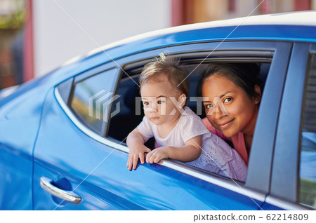 Young mom with baby girl 62214809