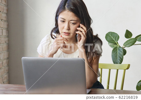 A woman who is suspicious of telephone and e-mail 62216819