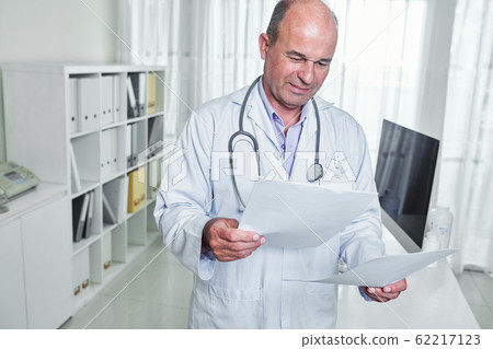 Doctor checking medical tests Doctor checking medical tests 62217123
