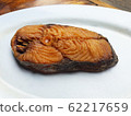 Fried salted fish in white dish 62217659