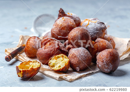 French beignets with powdered sugar and orange 62219980