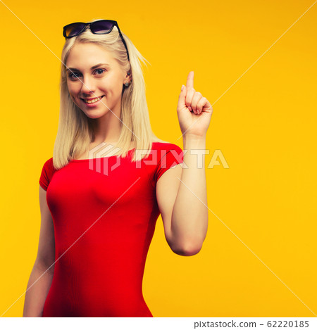pretty blond lifeguard in red swimsuit and 62220185