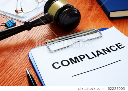 Compliance form and gavel in the court. 62222003