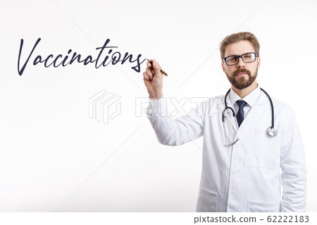 Male Physician Writing the Vaccination Word in Air 62222183