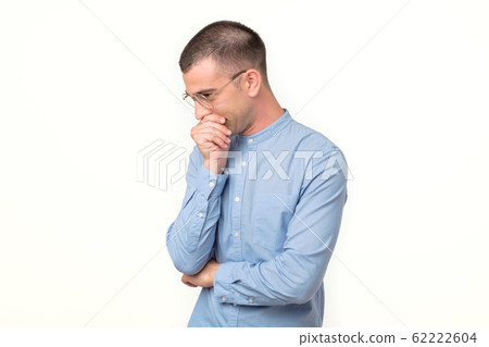 Hispanic young man thinking about idea or making a choice. Hispanic young man thinking about idea or making a choice. 62222604