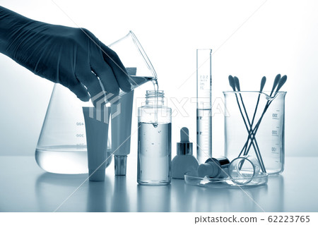 Dermatologist formulating and mixing pharmaceutical skincare. Dermatologist formulating and mixing pharmaceutical skincare. 62223765